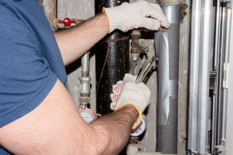 Plumber Working on a Pipe